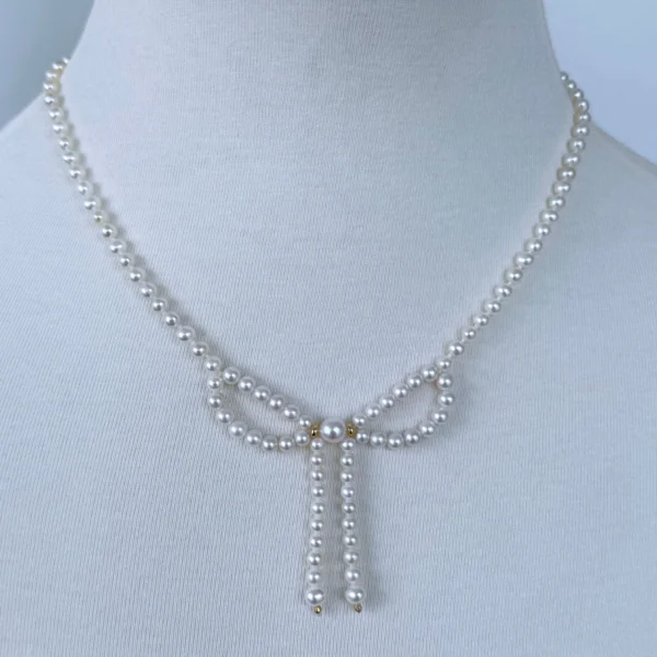 Pearl & Solid 14k Yellow Gold Accented Bow Necklace