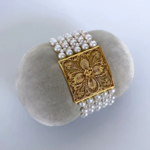 Pearl Woven Bracelet with 18k Yellow Gold Floral Centerpiece